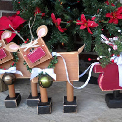 Whimsical wooden reindeers and a sleigh with simple shapes
